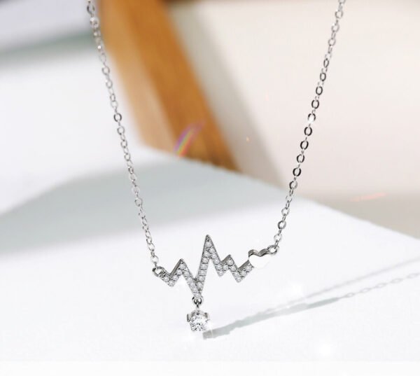 Titanium steel necklace beating heart design silver color